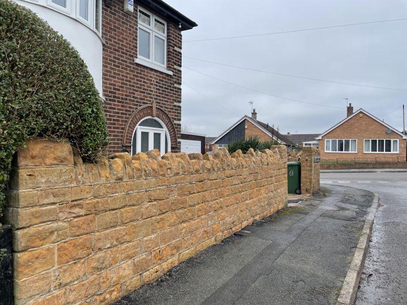 Stone wall in Langley mill, Derbyshire after being cleaned : Swipe To View More Images