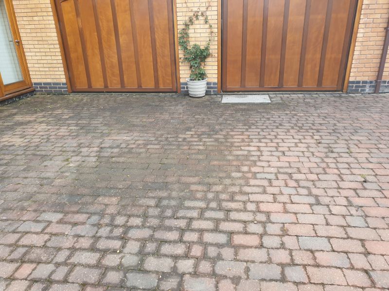 Block paving driveway before being pressure washed and re-sanded in Ilkeston: Swipe To View More Images