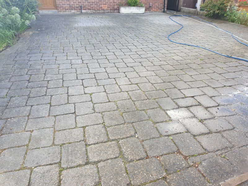 Block paving driveway before being pressure washed and re-sanded in Mackworth: Swipe To View More Images